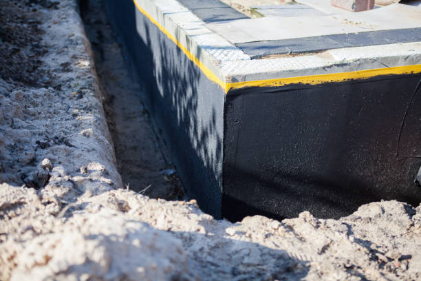 Professional Basement Waterproofing technician working in Birchwood, TN